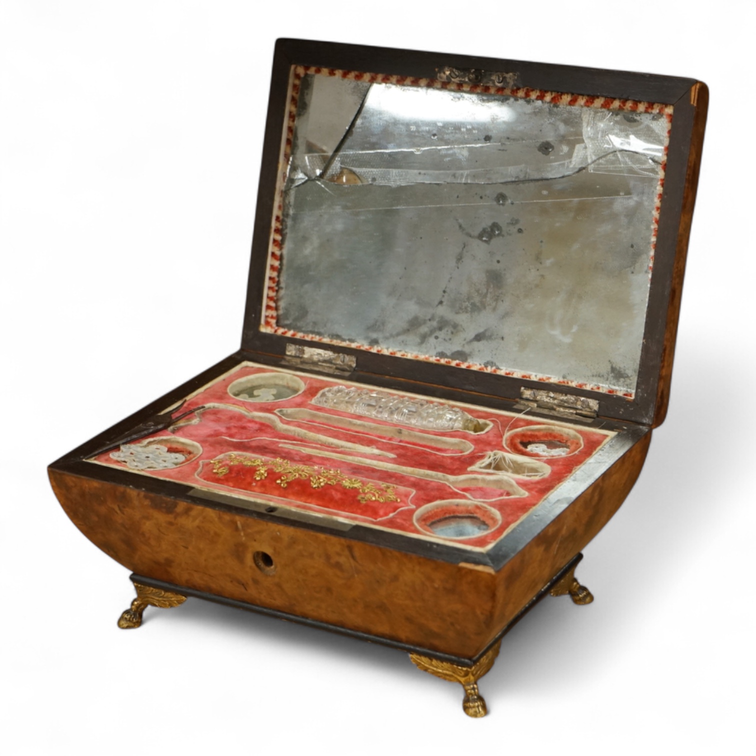 A 19th century burr walnut musical sewing box with mirrored and fitted interior and two silver keys, 18cm wide (mirror cracked)